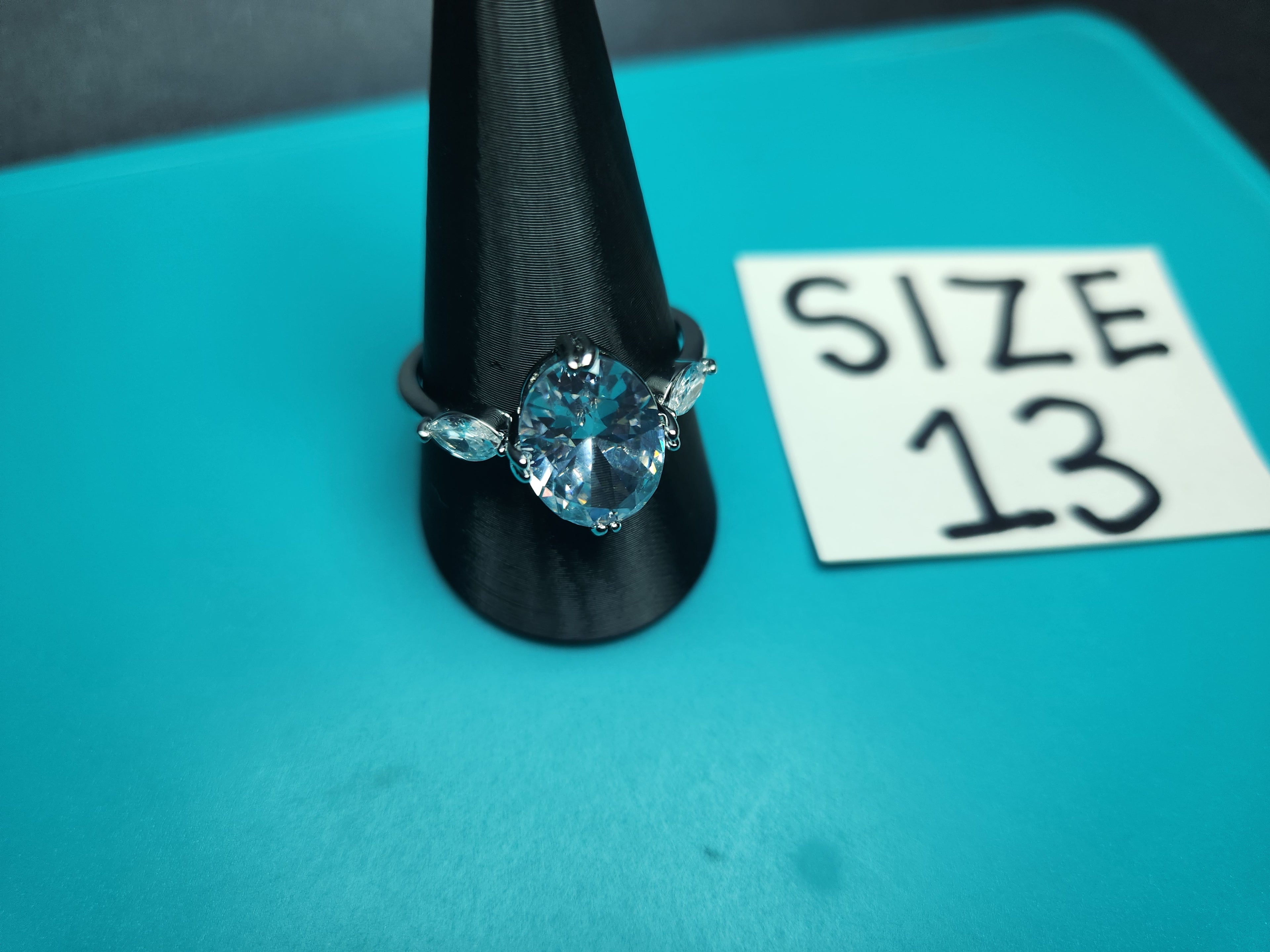 Size 13 Stainless Steel Pale Blue Oval Solitaire Ring with Marquise Accents