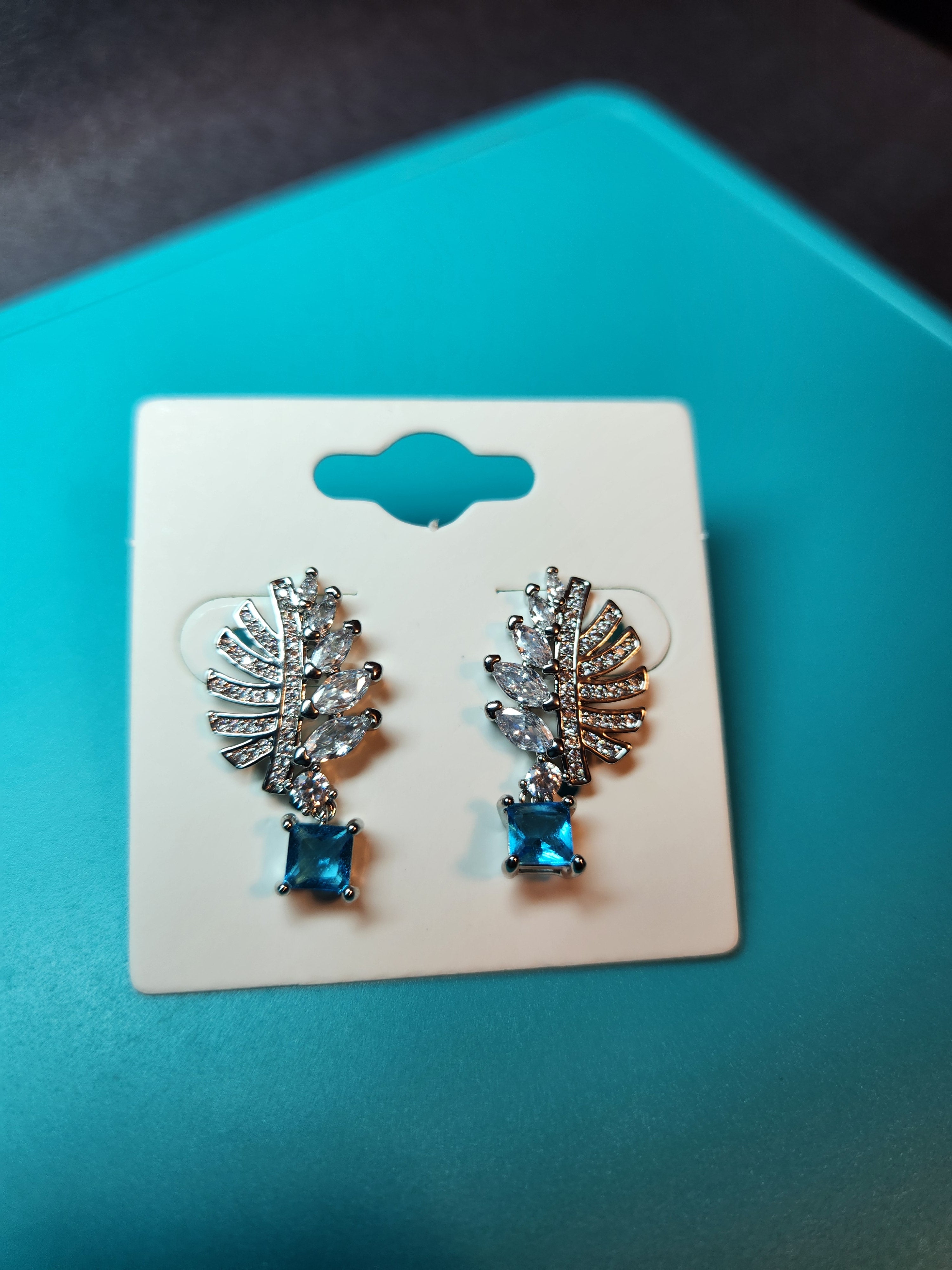 Sparkling Tropical Palm Frond Earrings with Cerulean Blue Drop